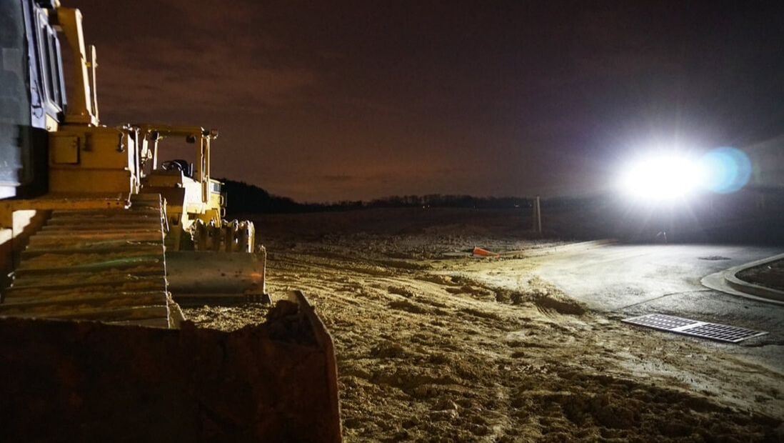 wor light night time construction site heavy equipment machinery yellow sitelites quad light led