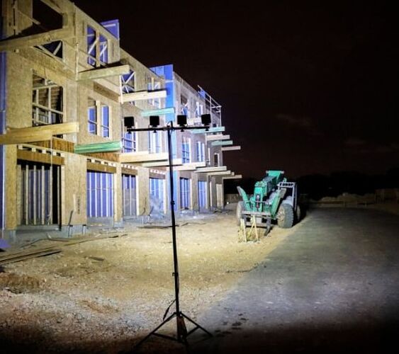 construction led lighting sitelites quad flood heavy equipment machinery new building at night
